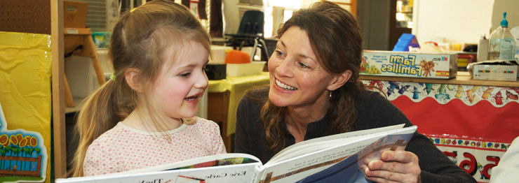 teacher reading with a young child